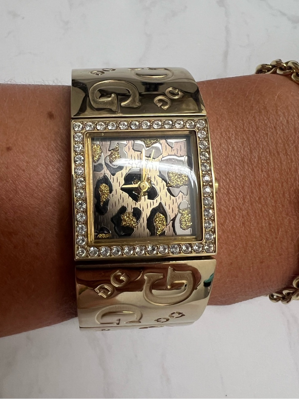 GUESS Gold Tone Leopard Print Cuff Watch – Crystal Accent Statement Timepiece